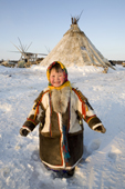 Yaline Laptander, a young Nenets girl, dressed in reindeer skin clothing at her family's winter camp in the Yamal. Western Siberia, Russia
