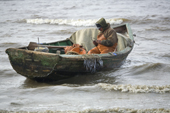 Arkhip Tokhma, A Khanty fisherman, working in his Budarka (boat) on the River Ob. Yamal, Western Siberia, Russia