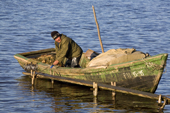 Arkhip Tokhma, A Khanty fisherman preparing his Budarka (boat) on the River Ob. Yamal, Western Siberia, Russia