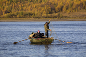 Arkhip Tokhma, A Khanty fisherman setting a fishing net from his Budarka (boat) on the River Ob. Yamal, Western Siberia, Russia