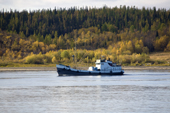 A cargo boat on the River Ob near Aksarka in the autumn. Yamal, Western Siberia, Russia