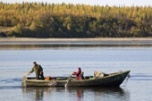 Arkhip Tokhma, A Khanty fisherman, setting off to fish in his Budarka (boat) with his wife & grandson on the River Ob. Yamal, Western Siberia, Russia