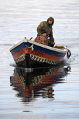 Nenets fishermen in a Budarka (boat) on the River Ob near Gornoknyazevsk. Yamal, Western Siberia, Russia