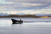 A Budarka (fishing boat) on the River Ob near Gornoknyazevsk with the Ural Mountains in the background. Yamal, Western Siberia, Russia