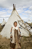 Maya Vengo, A Nenets woman, outside her family's tent at their summer reindeer pastures near Cup Lake. Gyda, Tazovsky region, Yamal, Siberia, Russia