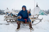 'Papa' Serotetto, an elderly Nenets reindeer herder at his winter camp on the tundra. Yamal, Northwest Siberia,Russia