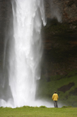 Tourists at Seljalandsfoss waterfall, South Coast, Iceland