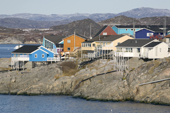 Brightly coloured modern houses close to the sea in Ilulissat. West Greenland