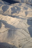 Aerial view of mountains and valleys formed by glaciers on Greenland's West Coast north of Ilulissat. West Greenland