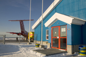 The airport terminal building at Upernavik in Northwest Greenland, with a dash 7 on the apron.